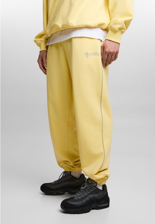 Nine spodnie dresowe oversize męskie żółte